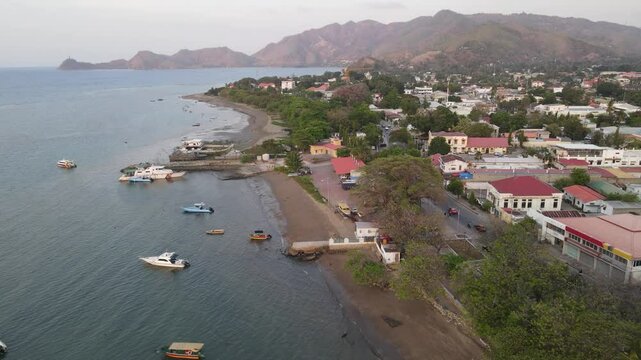 Dili City, Capital of East Timor, seen from the air in the Palacio Beach area, point 0 km of Dili City, before sunset. One of the favorite places in Dili.