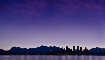 Obraz premium Silhouette of the Vancouver skyline with mountains in the background under a deep blue and purple sunset, Ai Generated