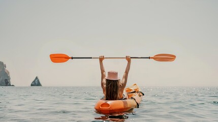 Kayak sea woman. Happy attractive woman with long hair in red swimsuit, swimming on kayak. Summer holiday vacation and travel concept.