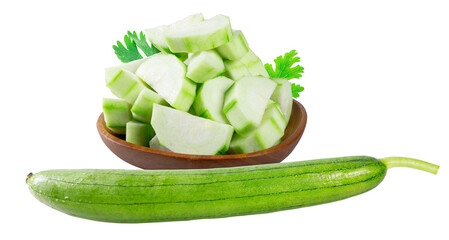 A whole sponge gourd and a bowl of sliced sponge gourd garnished with parsley, isolated on white...