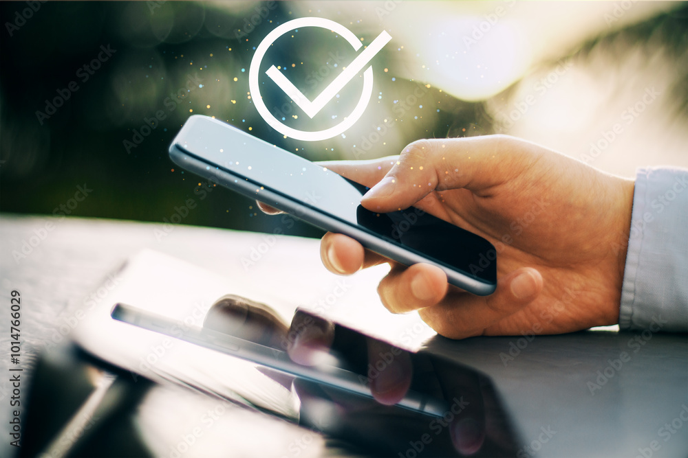 Poster hand holding smartphone with checkmark symbol indicating approval or success.