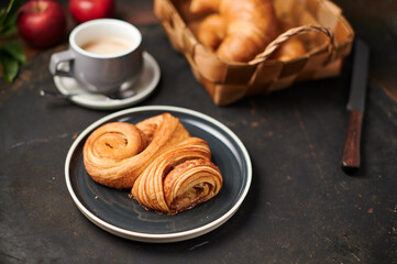 Franzbrötchen an original sweet pastry from Hamburg with a cup of latte