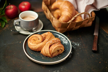 Franzbrötchen an original sweet pastry from Hamburg with a cup of latte