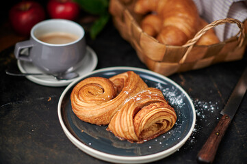 Franzbrötchen an original sweet pastry from Hamburg with a cup of latte