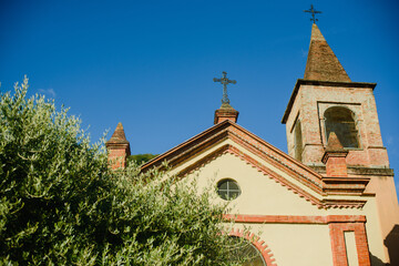 Fototapeta premium The facade of the Catholic Church in the old city of Europe. Northern Italy