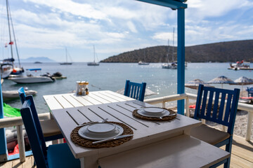 Typical Turkish Restaurant with Blue Tables and Chairs. Cokertme, Mugla - Turkey