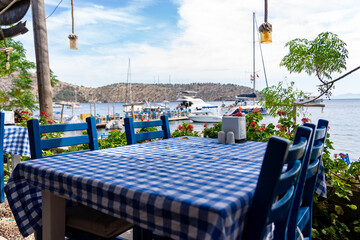 Typical Turkish Restaurant with Blue Tables and Chairs. Cokertme, Mugla - Turkey