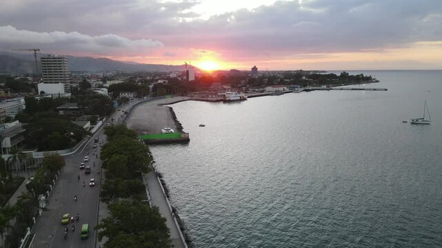 Dili City, Capital of East Timor, seen from the air in the Palacio Beach area, point 0 km of Dili City, before sunset. One of the favorite places in Dili.