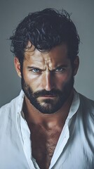 Fototapeta premium A handsome man with a beard, close-up portrait, an angry look on his face