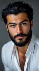 Obraz premium A handsome man with a beard, close-up portrait, an angry look on his face