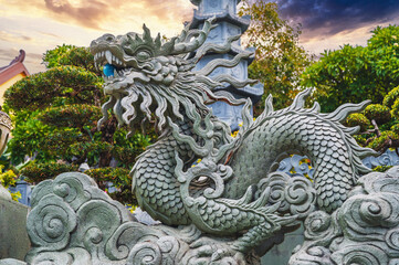 Stone Asian dragon statue on the Linh Ung Buddhist Pagoda in Da Nang in Vietnam in Asia