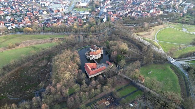 Circular aerial orbit around a medieval castle captured from a high bird&rsquo;s‑eye perspective.