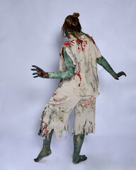 Fototapeta premium portrait of scary female model wearing spooky halloween costume wearing, ripped clothes and fake blood like an undead apocalyptic zombie character. Isolated walking figure on dark studio background