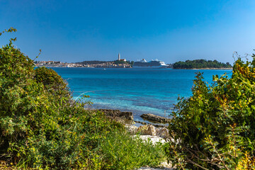 A huge tourist ship enters the port of Rovinj, sailing on the Adriatic Sea on a cruiser