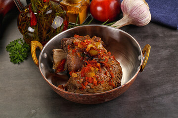 Baked beef ribs with vegetables