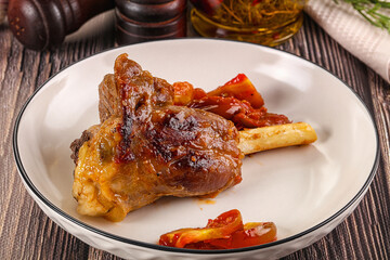 Baked lamb shank with vegetables