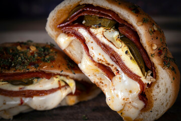 Warm melting pizza roll, hot pocket, or pepperoni roll. Melting cheese and meat with spicy peppers wrapped in crispy seasoned bread. 