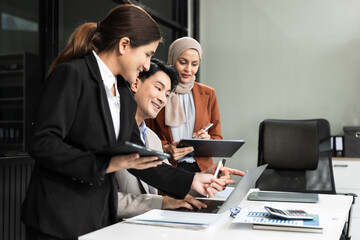 Business team meeting present.professional investor working with new startup project. Finance managers task.Digital tablet laptop computer design smart phone in morning light.