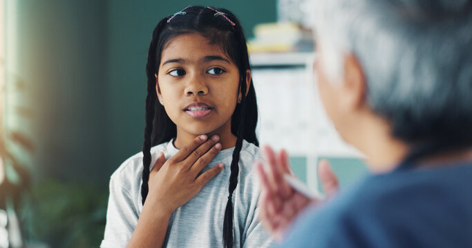 Child, girl and doctor in office for consultation, speech therapy or health treatment for sore throat. Healthcare, pediatrician and sick kid in clinic for advice, professional help or medical checkup