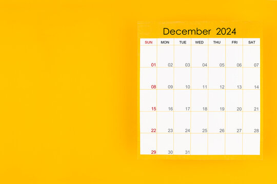 December 2024 caledar page on yellow background, Position with copy space.