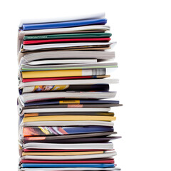 Neatly Stacked Pile of Colorful Magazines and Booklets.