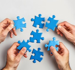 Hands Holding Blue Puzzle Pieces On Grey Background
