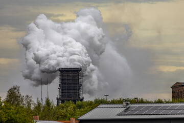 Smoke and steam released from the old factory chimney