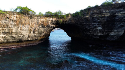 Popular tourist spot - Angel Bay Billabong. Natural arch at the exit from the bay to the sea, drone view