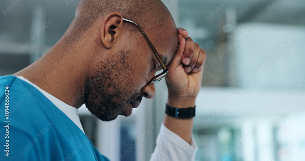 Wall mural Black man, doctor and stress in hospital for healthcare, mistake and regret in surgery. Surgeon, glasses and depression at window for crisis, overwhelmed and pressure with mental health awareness