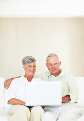 Couch, senior couple and laughing with laptop for movie, comedy film and entertainment in retirement. Happy people, woman and man with digital for streaming series, online video and bonding at home