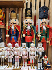 Colorful wooden nutcracker figurines on display for holidays