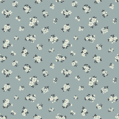 Vintage floral background. Floral pattern with small white flowers on a blue gray background. Seamless pattern for design and fashion prints. Ditsy style. Stock vector illustration.