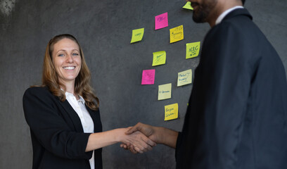 Businessman and businesswoman using problem-solving strategy, showcasing collaboration and success...