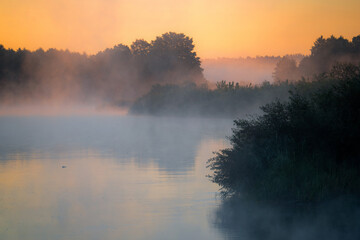 Misty Sunrise Over Tranquil Lake