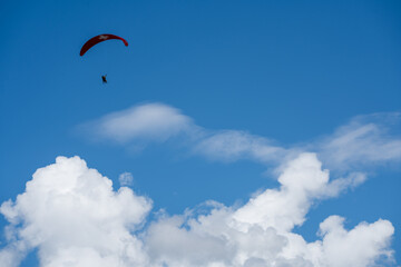Paraglider high above the Swiss Alps, near Gimmelwald, Switzerland