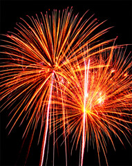 Obraz premium Glowing golden fireworks bursting with vivid intensity in the night sky