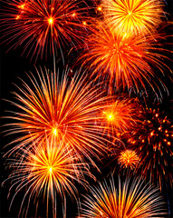 Dazzling golden fireworks lighting up the sky in vibrant bursts