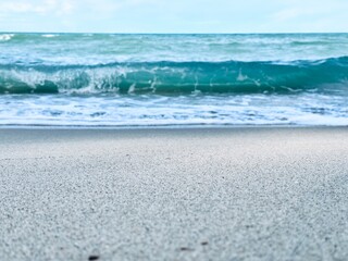 Wave of sea with white foam. water splash in the sea. Splash sea. Clear water and white sand