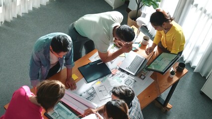 Time lapse of civil engineer team working together to plans building construction. Top view of...