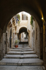 Arched tunnel alleyway and staircase through the Jewish Quarter of the Old City of Jerusalem.