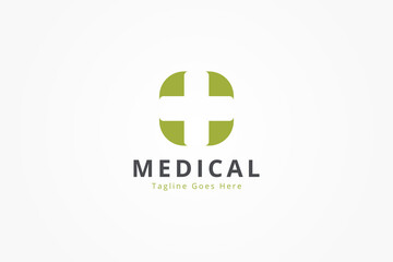 Simple Healthcare Medical Logo. Green Geometric Shape With Negative Space Cross Plus Sign Isolated On White Background. Flat Vector Logo Design Template Element For Hospital And Health Clinic Logos.
