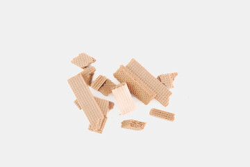 A pile of broken wafers on a white background