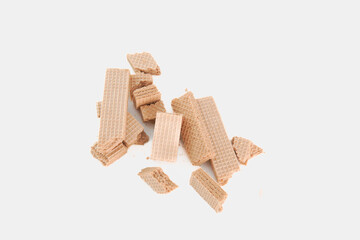 A pile of broken wafers on a white background