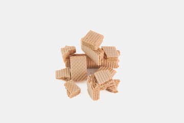A pile of broken wafers on a white background