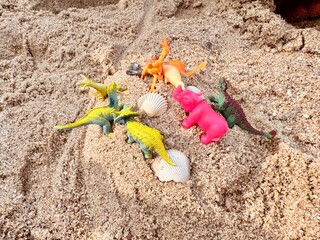 Beach Toys in the Sand. Set of plastic sand toys for children On sand near sea. sand beach with accessories. Boat toys on sand