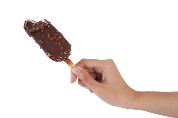 A hand holding a chocolate ice cream stick