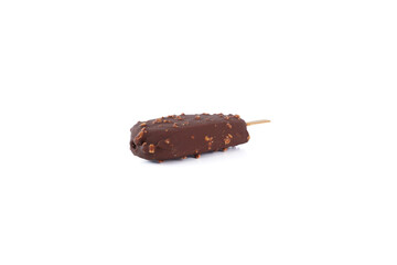 A chocolate bar with nuts on it is sitting on a white background