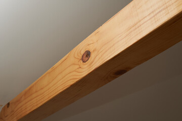 A round hole in a wooden beam