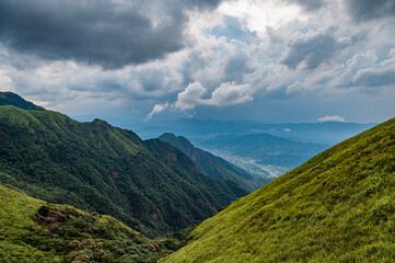 The mountainous landscape of the approaching storm