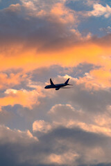 An airplane in the dusk sky